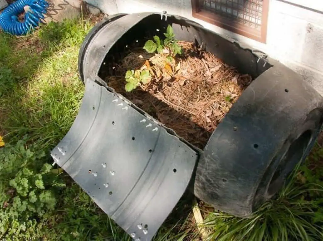 A compost tumbler recycling green waste