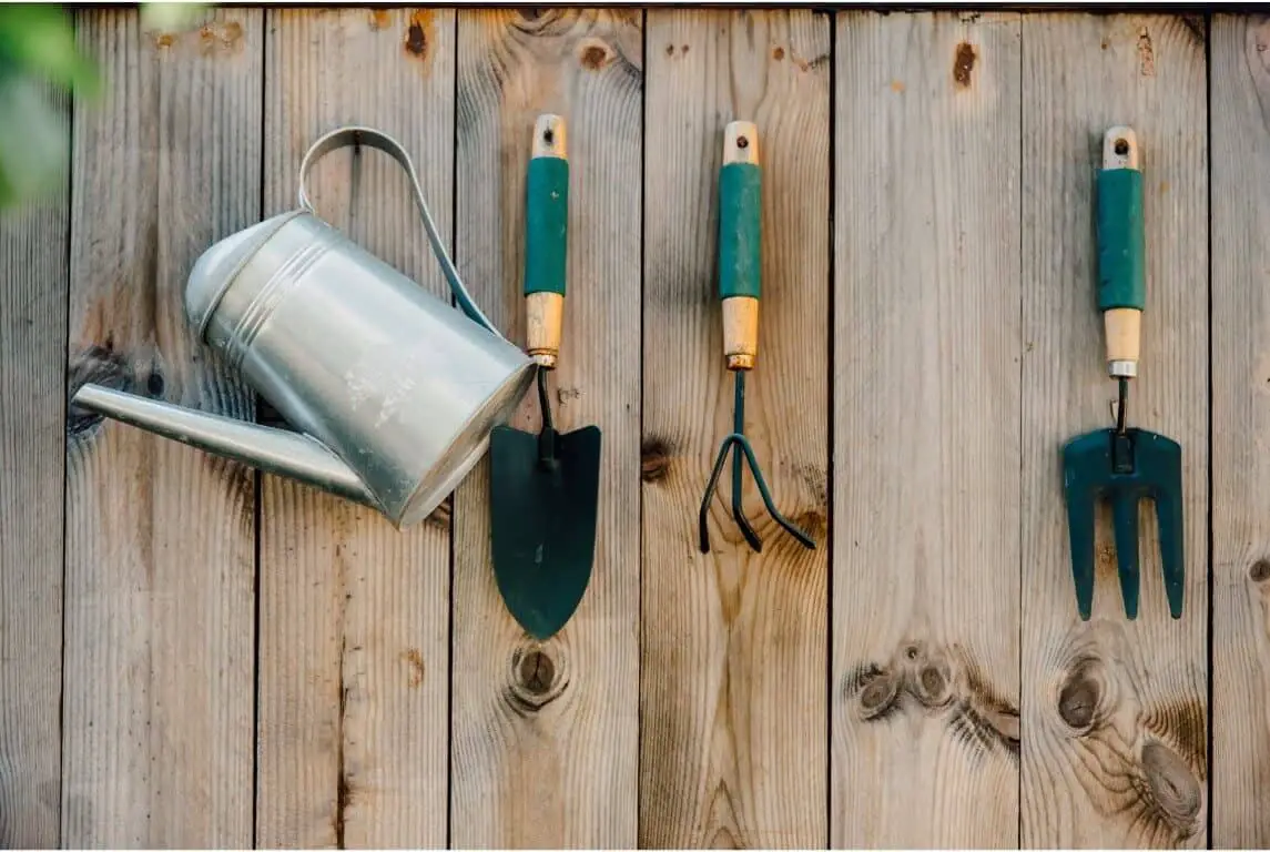 Construct an outdoor garden hose holder